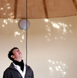 Earthship Brighton visitor opening a skylight